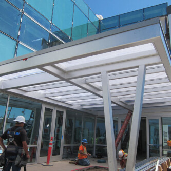Entrance awning made out of clear-PEP satin translucent honeycomb panels Entrance awning made out of clear-PEP satin translucent honeycomb panels