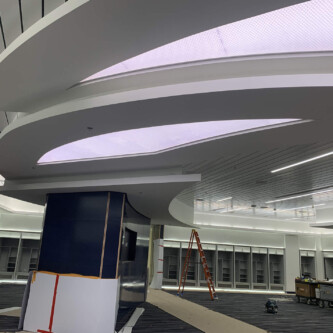 clear-PEP ECO PC stage - backlit ceiling illuminator in shopping mall Moxie Surfaces - clear-PEP ECO PC stage - backlit ceiling illuminator in shopping mall