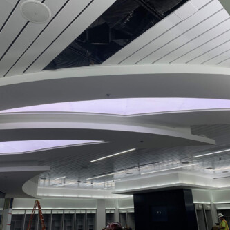 clear-PEP ECO PC stage - backlit ceiling illuminator in shopping mall Moxie Surfaces - clear-PEP ECO PC stage - backlit ceiling illuminator in shopping mall