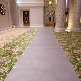 clear-PEP ECO PC stage panels protecting the world’s largest carpet at Sheikh Zayed Grand Mosque MoxieSurfaces - clear-PEP ECO PC stage at Sheikh Zayed Grand Mosque