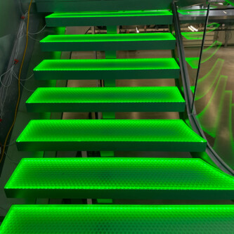 Green backlit stairs with clear-PEP ECO PC stage panels MoxieSurfaces - clear-PEP ECO PC stage - garage backlit stairs