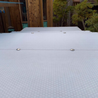 clear-PEP ECO panels in clear blue and satin opal white, complementing a wooden residence with elegant awnings and canopies MoxieSurfaces - clear-PEP ECO panels - Digigloramo Residence