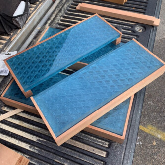 clear-PEP ECO panels in clear blue and satin opal white, complementing a wooden residence with elegant awnings and canopies MoxieSurfaces - clear-PEP ECO panels - Digigloramo Residence