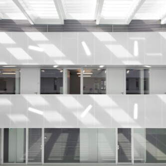 Translucent wall and ceiling acoustic panels quietly change how a space feels MoxieSurfaces - AIR-board translucent wall and ceiling acoustic panels in Logistics Complex