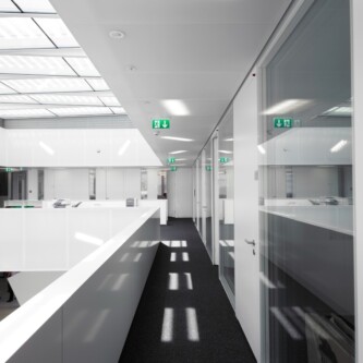 Translucent wall and ceiling acoustic panels quietly change how a space feels MoxieSurfaces - AIR-board translucent wall and ceiling acoustic panels in Logistics Complex