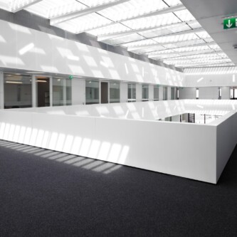 Translucent wall and ceiling acoustic panels quietly change how a space feels MoxieSurfaces - AIR-board translucent wall and ceiling acoustic panels in Logistics Complex