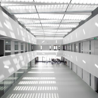 Translucent wall and ceiling acoustic panels quietly change how a space feels MoxieSurfaces - AIR-board translucent wall and ceiling acoustic panels in Logistics Complex