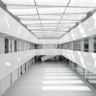 Translucent wall and ceiling acoustic panels quietly change how a space feels MoxieSurfaces - AIR-board translucent wall and ceiling acoustic panels in Logistics Complex