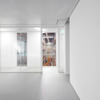 Translucent wall and ceiling acoustic panels quietly change how a space feels MoxieSurfaces - AIR-board translucent wall and ceiling acoustic panels in Logistics Complex